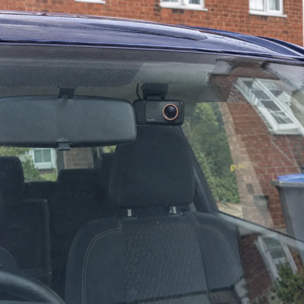 Helen's son's car with the Halden behind the mirror