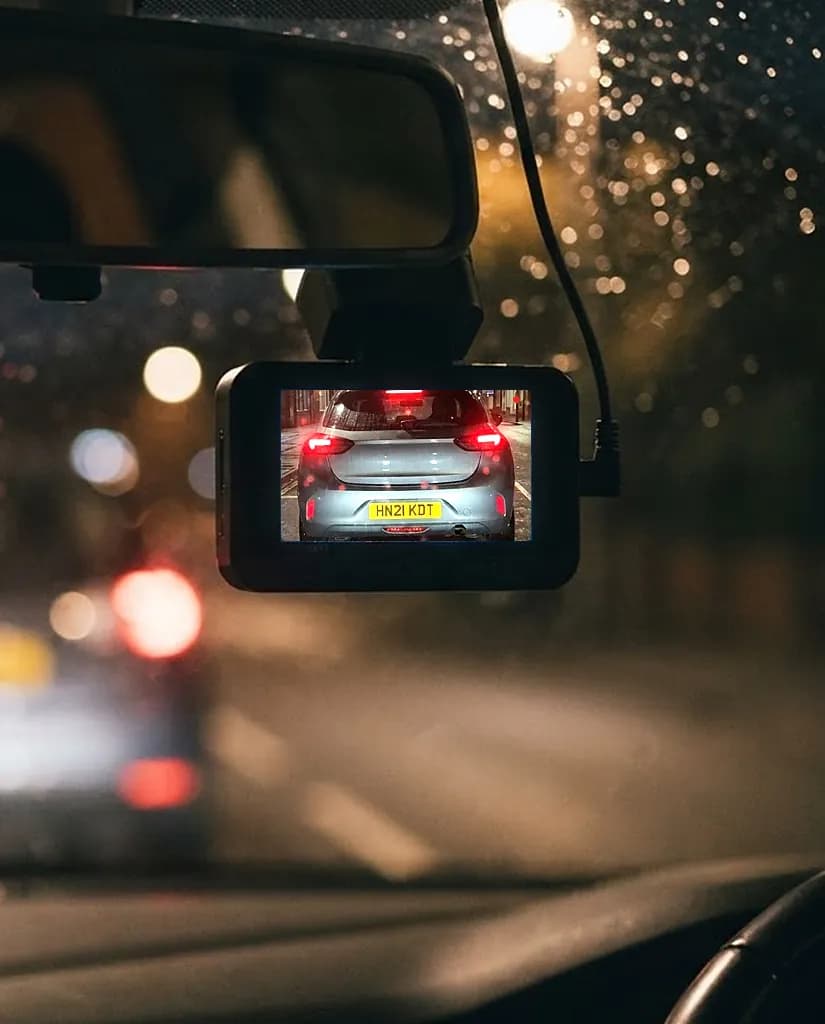 At night in the rain, the Halden behind the rear-view mirror, its screen showing the car ahead with the number plate sharp and readable